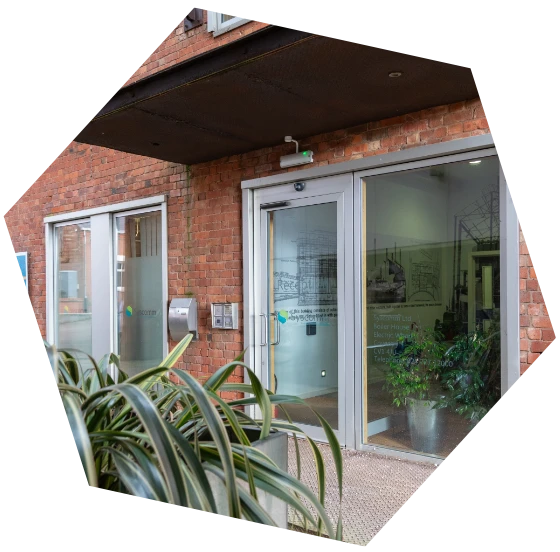 Exterior view of the Syscomm office entrance featuring glass doors and company branding