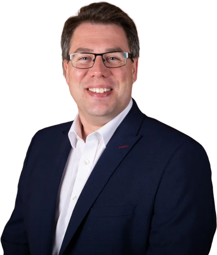 Torso shot of co director Chris wearing suit